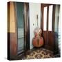 Double Bass Propped Against a Wall, Cienfuegos, Cuba, West Indies, Central America-Lee Frost-Stretched Canvas