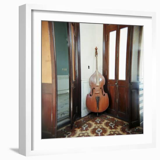 Double Bass Propped Against a Wall, Cienfuegos, Cuba, West Indies, Central America-Lee Frost-Framed Photographic Print