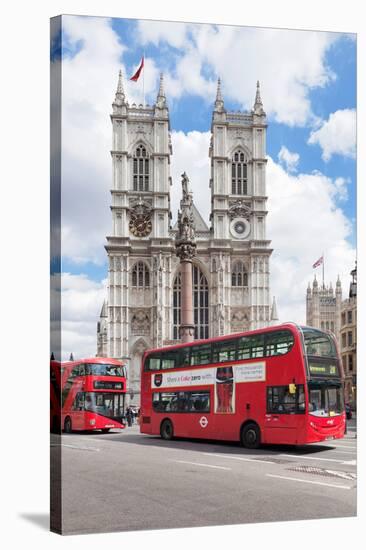 Double-Decker Buses Passing by a Cathedral, Westminster Abbey, City of Westminster, London, England-null-Stretched Canvas