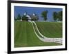 Double White Fence Flows from an Elegant Horse Barn, Woodford County, Kentucky, USA-Dennis Flaherty-Framed Photographic Print