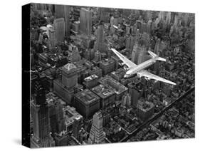 Douglas 4 Flying over Manhattan-Margaret Bourke-White-Stretched Canvas