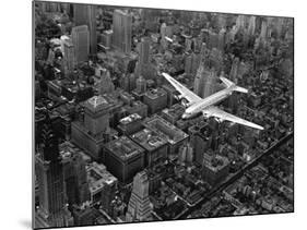 Douglas 4 Flying over Manhattan-Margaret Bourke-White-Mounted Photographic Print