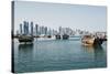Downtown Doha with its Impressive Skyline of Skyscrapers and Authentic Dhows in the Bay-Matt-Stretched Canvas