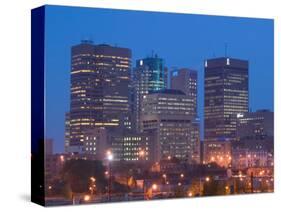 Downtown Highrise Buildings from The Forks at Dawn, Winnipeg, Manitoba-Walter Bibikow-Stretched Canvas