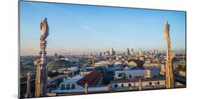 Downtown Milan as seen through the roof of the city's famous Duomo cathedral, Milan, Lombardy, Ital-Alexandre Rotenberg-Mounted Photographic Print