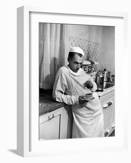 Dr. Ernest Ceriani in a State of Exhaustion, Having a Cup of Coffee in the Hospital Kitchen at 2 AM-W^ Eugene Smith-Framed Photographic Print