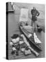 Dr. Hannes Lindemann Standing Next to the Folding Boat He Crossed the Atlantic Ocean In-Peter Stackpole-Stretched Canvas