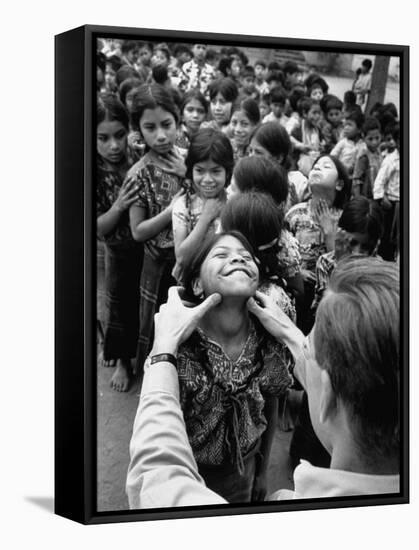 Dr. Nevin S. Scrimshaw of the Central American Institute of Nutrition Examining Children for Goiter-Cornell Capa-Framed Stretched Canvas