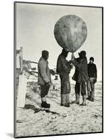 'Dr. Simpson Sending Up a Balloon', 1911, (1913)-Herbert Ponting-Mounted Photographic Print