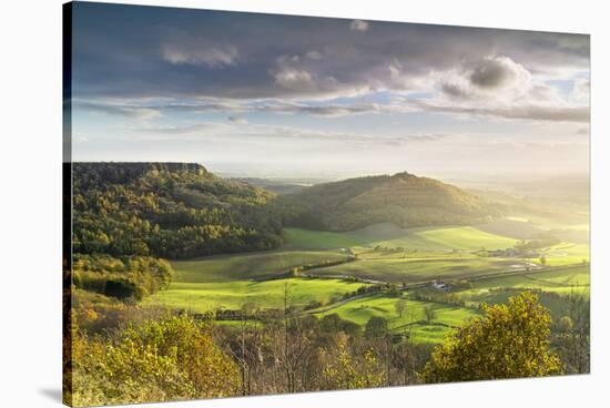Dramatic weather and skies over The Vale of York from Sutton Bank, The North Yorkshire Moors-John Potter-Stretched Canvas