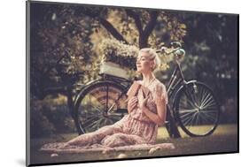 Dreaming Blond Retro Woman with a Book Sitting on a Meadow-NejroN Photo-Mounted Photographic Print