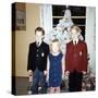 Dressed Up Siblings Stand by the Christmas Tree, Ca. 1965-null-Stretched Canvas