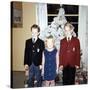 Dressed Up Siblings Stand by the Christmas Tree, Ca. 1965-null-Stretched Canvas