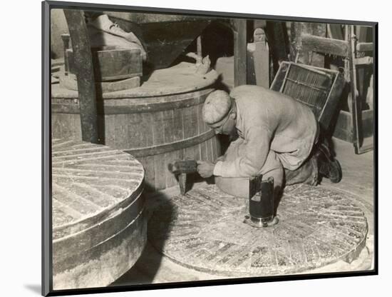 Dressing a Millstone at a Water Mill at Ewell Surrey-null-Mounted Art Print