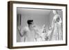 Drinking Guest Looking at a Display at the Met Fashion Ball, New York, New York, November 1960-Walter Sanders-Framed Photographic Print