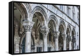 Dubrovnik, Croatia. Ornate columns at Sponza Palace.-Tom Haseltine-Framed Stretched Canvas