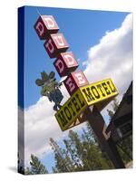 Dude Motel Sign, West Yellowstone, Montana, USA-Nancy & Steve Ross-Stretched Canvas