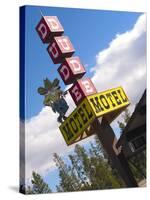 Dude Motel Sign, West Yellowstone, Montana, USA-Nancy & Steve Ross-Stretched Canvas