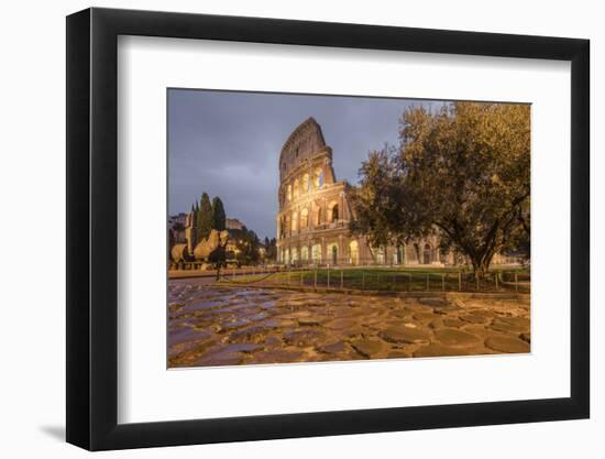 Dusk lights on the Colosseum, the old Flavian Amphitheatre, and symbol of the city, UNESCO World He-Roberto Moiola-Framed Photographic Print