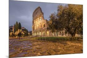 Dusk lights on the Colosseum, the old Flavian Amphitheatre, and symbol of the city, UNESCO World He-Roberto Moiola-Mounted Premium Photographic Print