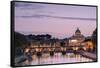 Dusk Lights on Tiber River with Bridge Umberto I and Basilica Di San Pietro in the Background, Rome-Roberto Moiola-Framed Stretched Canvas