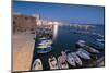 Dusk lights the harbor and the medieval old town of Gallipoli, Province of Lecce, Apulia, Italy, Eu-Roberto Moiola-Mounted Photographic Print