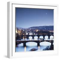 Dusk lights up the historical bridges and buildings reflected on Vltava River, Prague, Czech Republ-Roberto Moiola-Framed Photographic Print