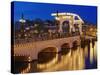 Dusk view of Magere Brug or Skinny Bridge and Amstel River, Netherlands, Holland-Adam Jones-Stretched Canvas