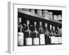 Dust-Covered Wine and Brandy Bottles Standing on Racks in a Wine Cellar-null-Framed Photographic Print