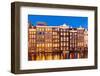 Dutch gables on row of typical Amsterdam houses at night with reflections in the Damrak canal-Neale Clark-Framed Photographic Print