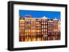 Dutch gables on row of typical Amsterdam houses at night with reflections in the Damrak canal-Neale Clark-Framed Photographic Print