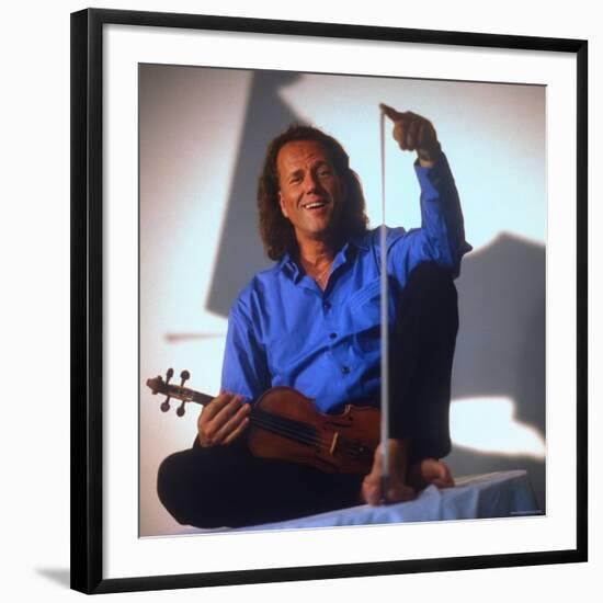 Dutch Violinist Andre Rieu Relaxing, Taking Practice Break with Violin-Ted Thai-Framed Premium Photographic Print