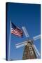 Dutch windmill and US flag, Nelis' Dutch Village, Holland, Michigan.-Randa Bishop-Stretched Canvas