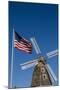 Dutch windmill and US flag, Nelis' Dutch Village, Holland, Michigan.-Randa Bishop-Mounted Photographic Print