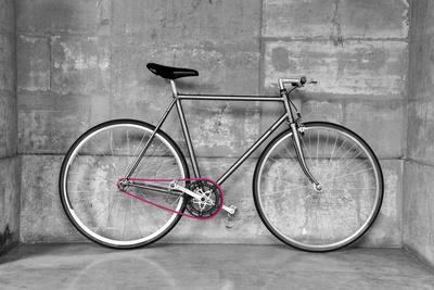 A Fixed-Gear Bicycle (Or Fixie) In Black And White With A Pink Chain