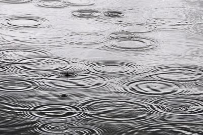 Raindrops On The Water Surface