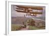 Early Biplane Flying Above a Car on a Country Road-null-Framed Giclee Print