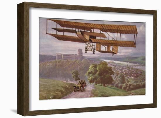 Early Biplane Flying Above a Car on a Country Road-null-Framed Giclee Print