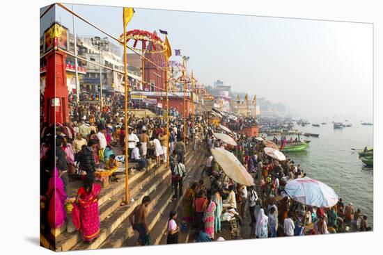 Early Morning Bathers on the Banks of the River Ganges, Varanasi (Benares), Uttar Pradesh, India-Jordan Banks-Stretched Canvas