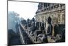 Early Morning Light Shining on Buddhas Sitting in the Temple Complex of Borobodur, Java, Indonesia-Michael Runkel-Mounted Photographic Print