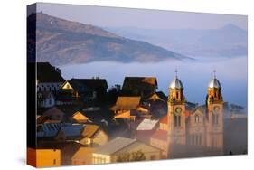 Early morning mist on the Haute Ville old town, Ambozontany Cathedral, Fianarantsoa, central area, -Christian Kober-Stretched Canvas