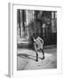 East German Girl Playing with a Spinning Top-Ralph Crane-Framed Photographic Print