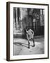 East German Girl Playing with a Spinning Top-Ralph Crane-Framed Photographic Print