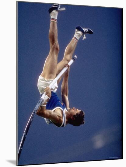 East Germany's Wolfgang Nordwig in Action During Pole Vaulting Event at the Summer Olympics-John Dominis-Mounted Premium Photographic Print