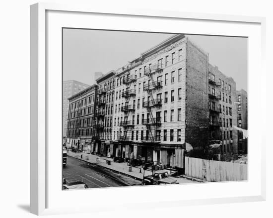 East Harlem's 100th St. with a Large Tenement Apartment Building in NYC, 1964-null-Framed Photo