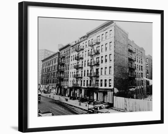 East Harlem's 100th St. with a Large Tenement Apartment Building in NYC, 1964-null-Framed Photo