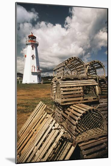 East Point Lighthouse and Lobster Traps, Prince Edward Island, Canada-Walter Bibikow-Mounted Photographic Print