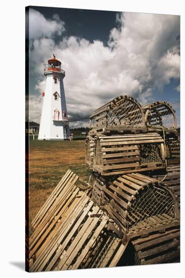 East Point Lighthouse and Lobster Traps, Prince Edward Island, Canada-Walter Bibikow-Stretched Canvas