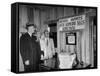 Eastern Airline Representative Eddie Rickenbacker Reading a Sign at His Companies Airport-null-Framed Stretched Canvas