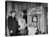 Eastern Airline Representative Eddie Rickenbacker Reading a Sign at His Companies Airport-null-Stretched Canvas